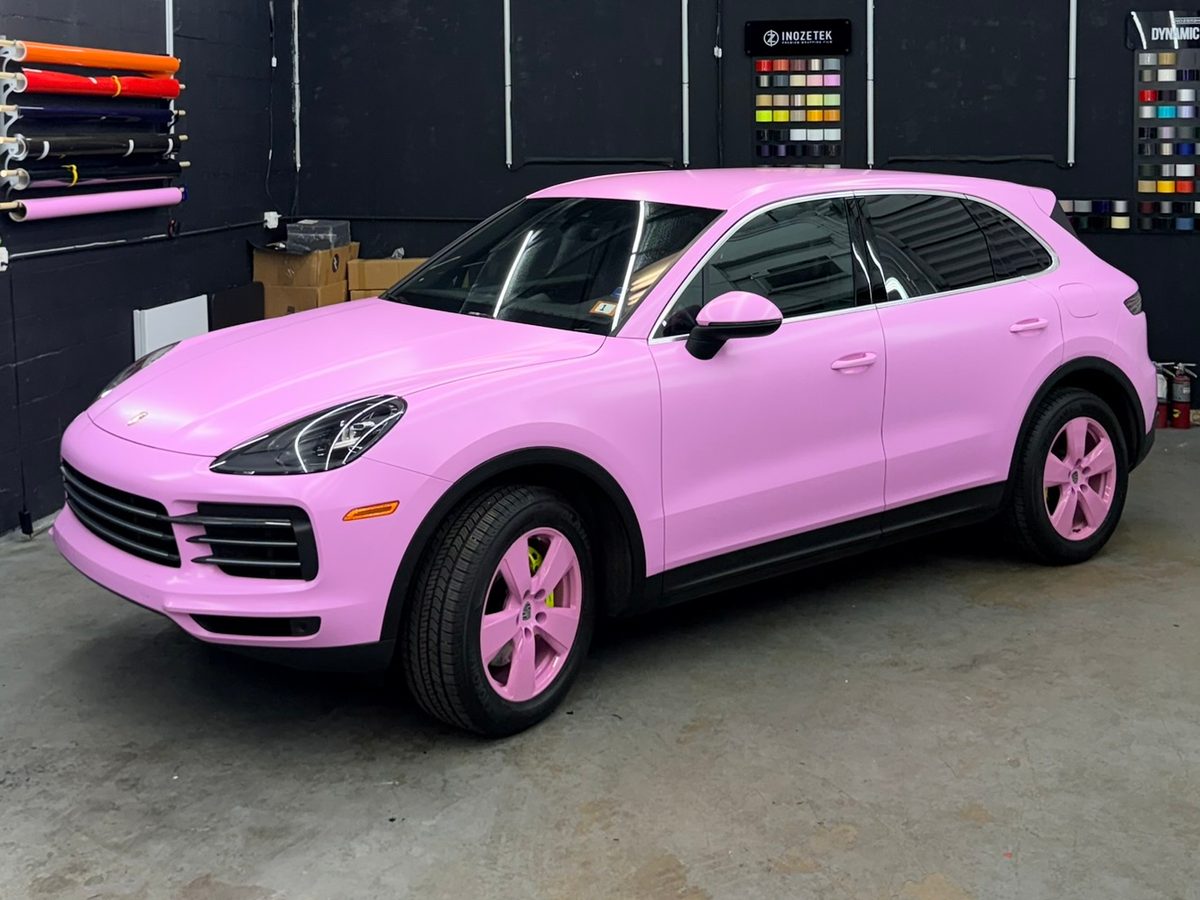 Porsche Cayenne in a pink color-change wrap