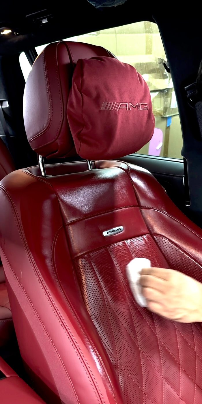 AMG leather seat being cleaned by hand