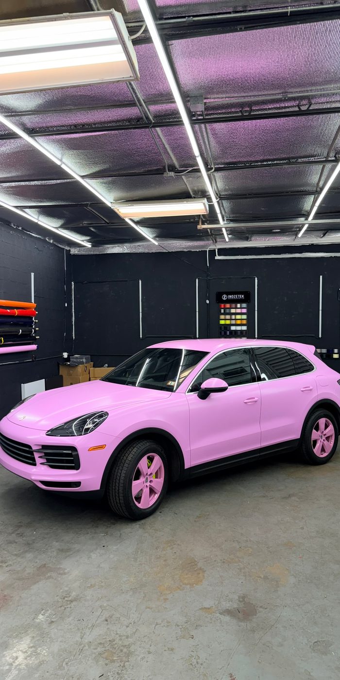Porsche Cayenne in a pink color-change wrap