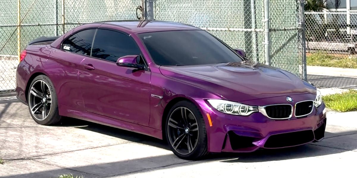 BMW M4 in a purple color-change wrap