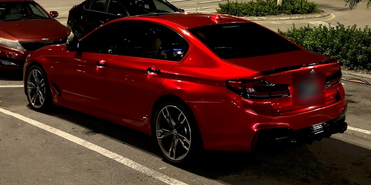 Red BMW M5 at night