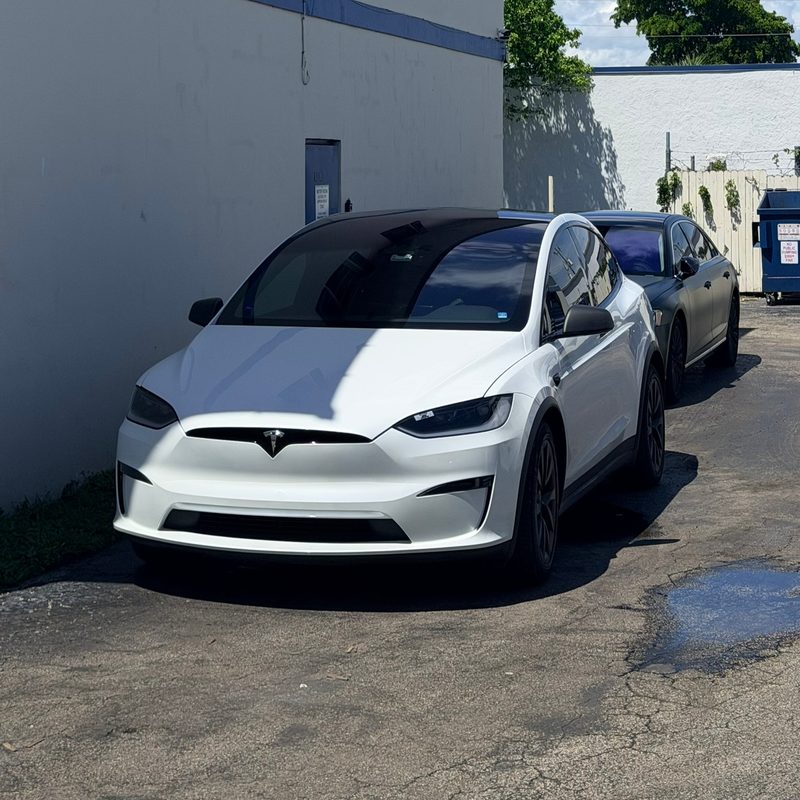 White Tesla Model X outside the studio