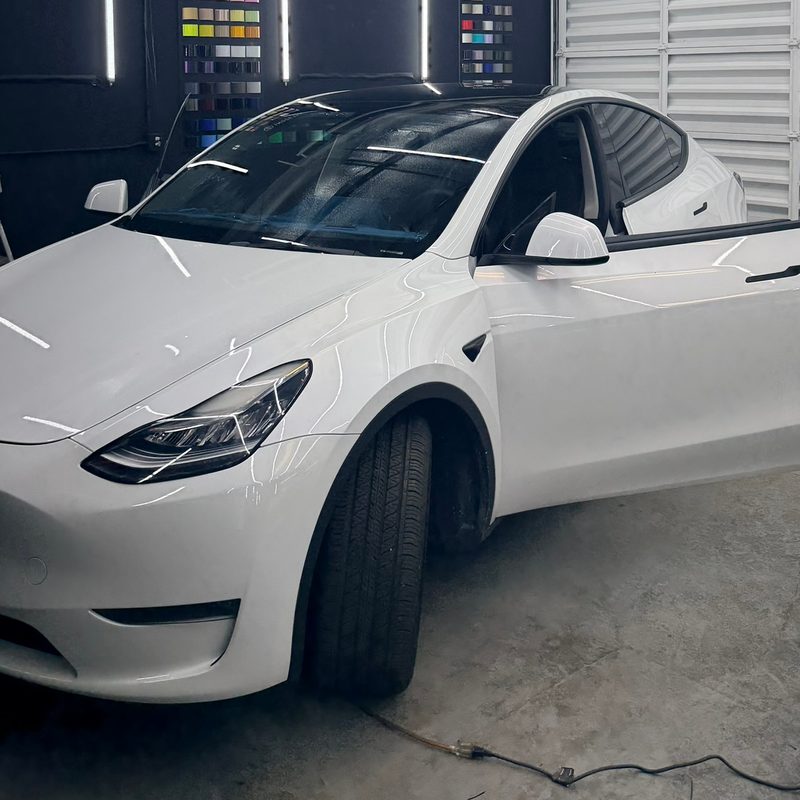 White Tesla Model Y in the bay