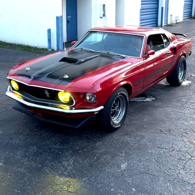 Classic Ford Mustang in red with a black hood