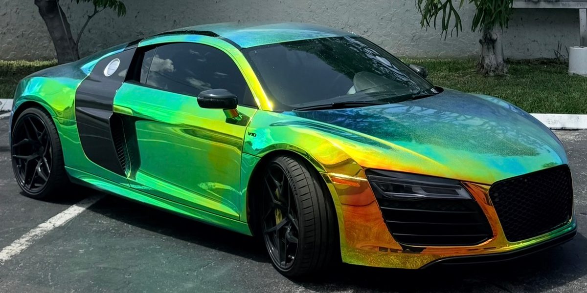 Audi R8 in a holographic wrap, outside the studio
