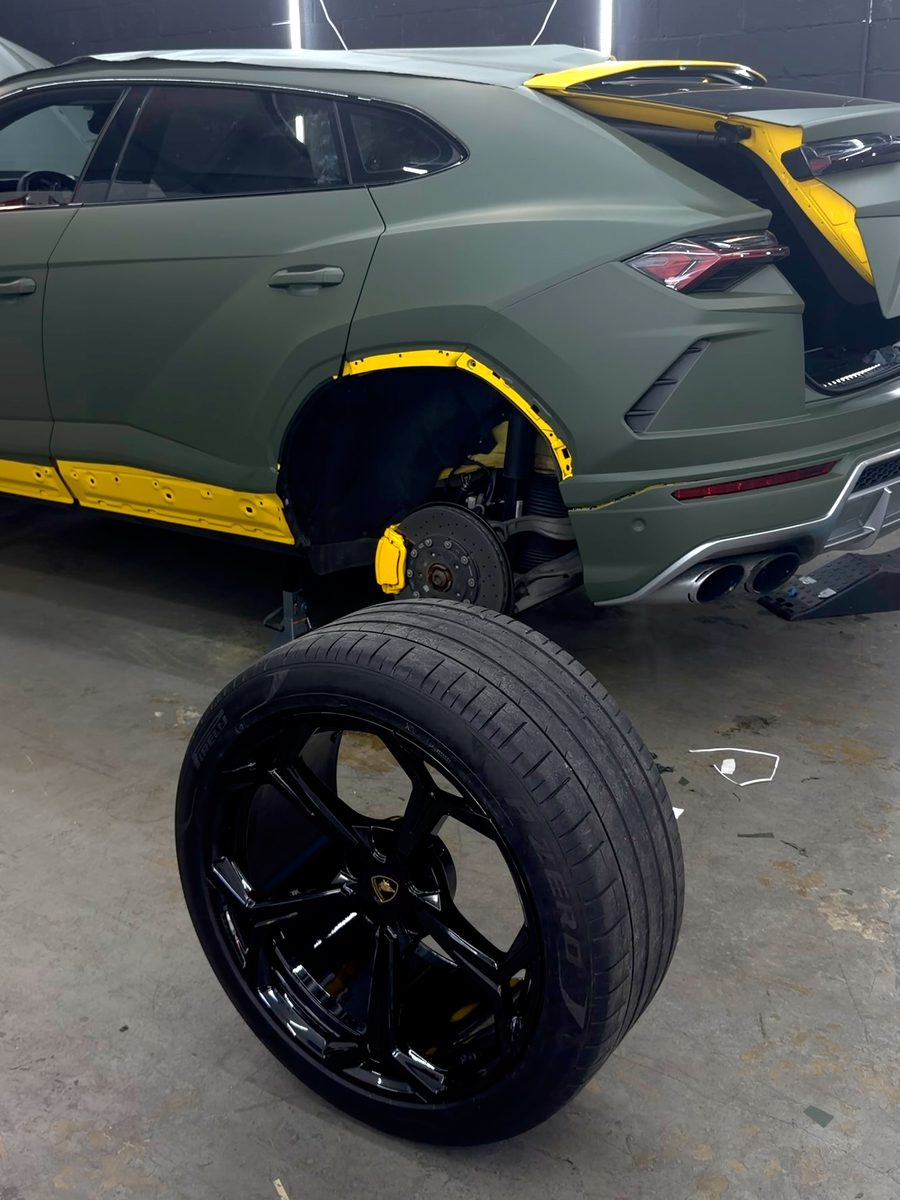 Lamborghini Urus with a wheel off in the bay
